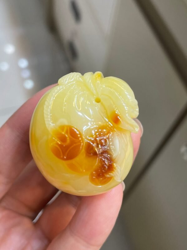 The natural raw mineral white flower cleverly carved and colorful honey wax money bag pendant is approximately 36.6x31.9x29.4mm in size0811790133